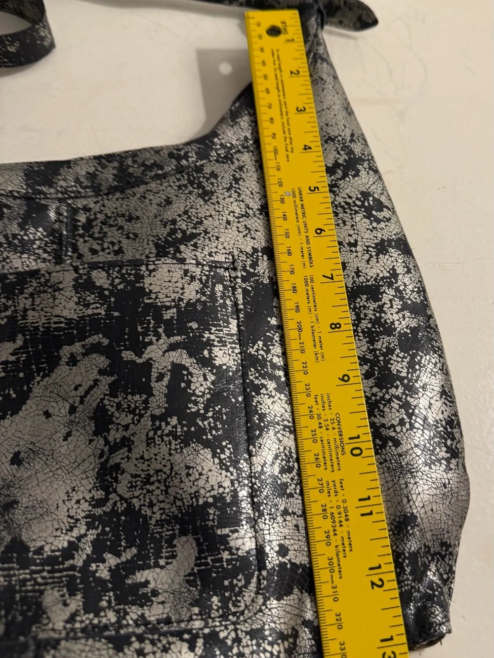 Elie metallic silver/black leather hobo bag.(Made in USA)